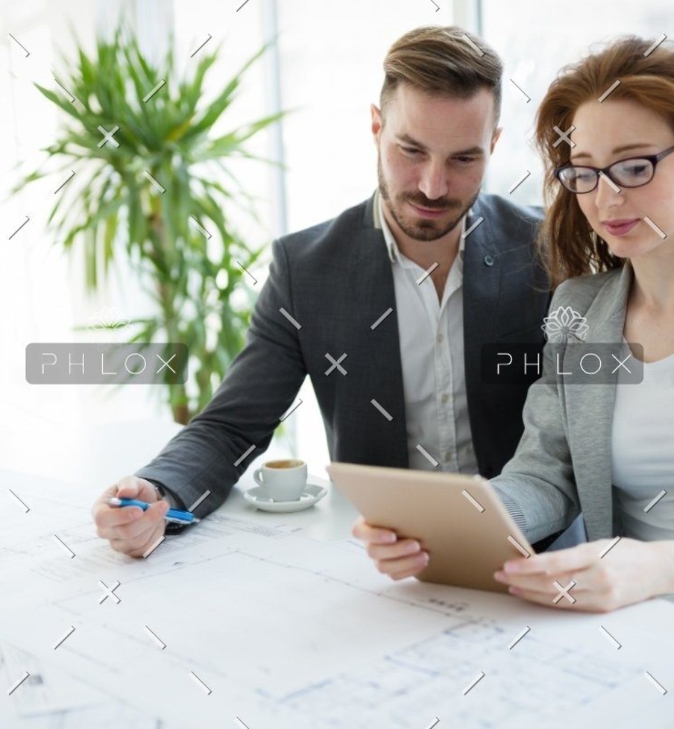 demo-attachment-818-portrait-of-young-architect-woman-on-meeting-KFZCE3A